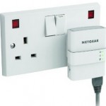 Netgear Ethernet Powerline adapter plugged into the mains electricity supply