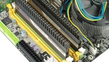 RAM memory requirements -Corsair RAM DIMM modules with heatspreaders in their slots on a motherboard