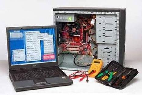 Image of desktop and laptop PCs plus toolkit