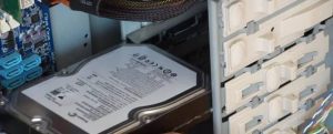SATA hard disk drive sliding into its 3.5-inch bay